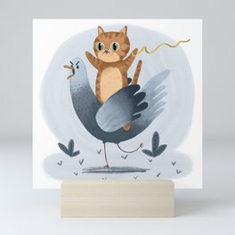 Cat Riding a Pigeon Mini Art Print