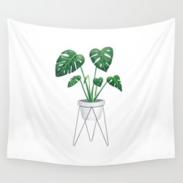 Monstera in designer plant stand with green leaves and foliage Wall Tapestry