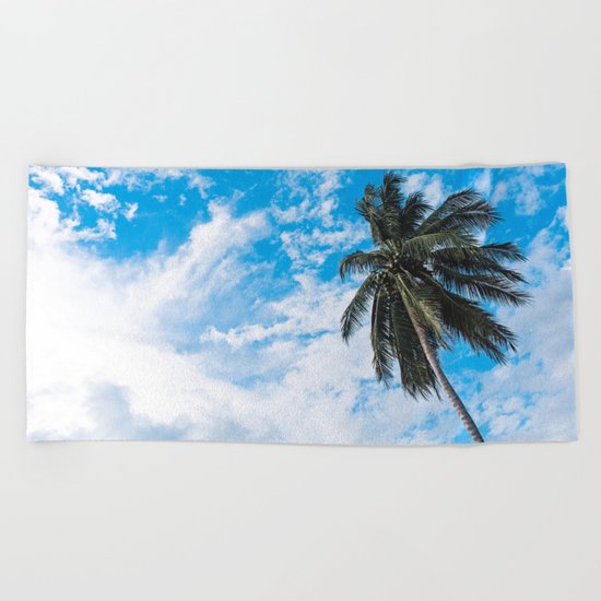 Palm Tree under Blue and White Beach Towel