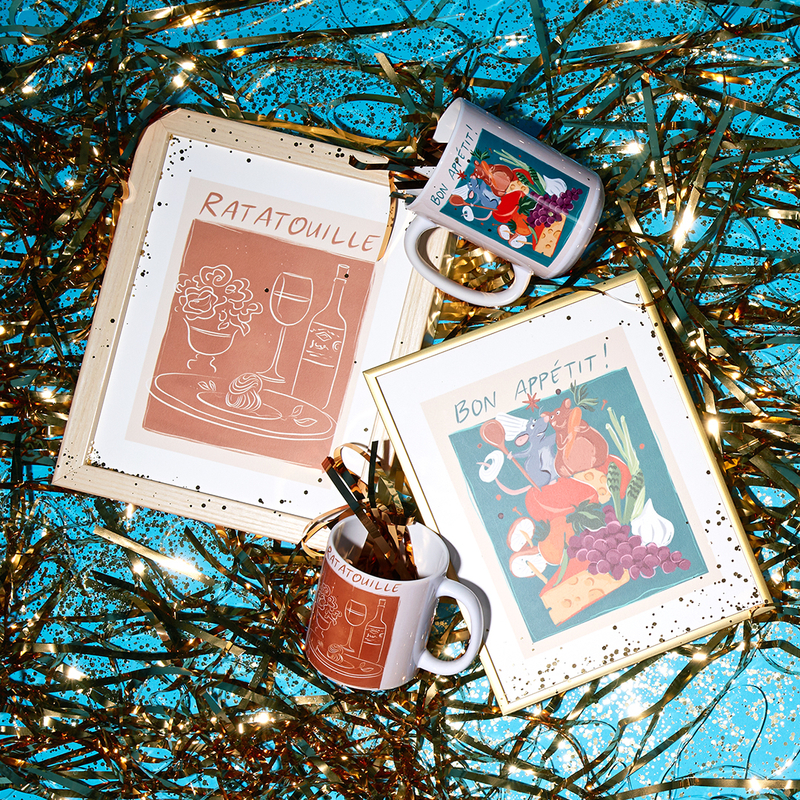 festive flatlay with Ratatouille themed framed prints and mugs