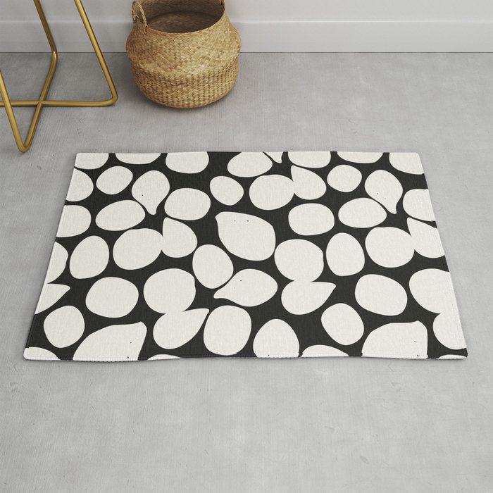 Black and white contrasting pattern with petals Rug