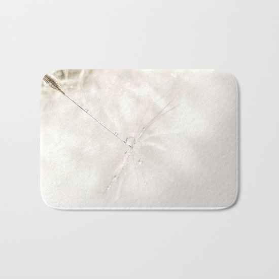 Sparkling dandelion seed head with droplet Bath Mat