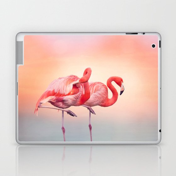 Two Pink flamingos in the water at sunset Laptop & iPad Skin