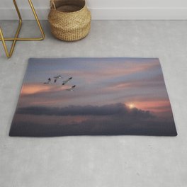 SNOW GEESE IN THE CLOUDS Rug