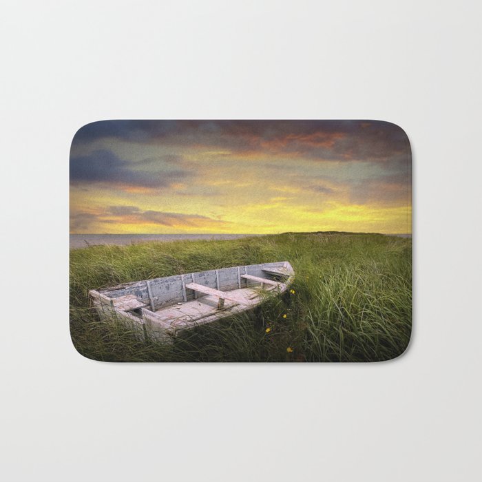 Stranded Row Boat in the Beach Grass at Sunrise on the shore on Prince Edward Island Bath Mat