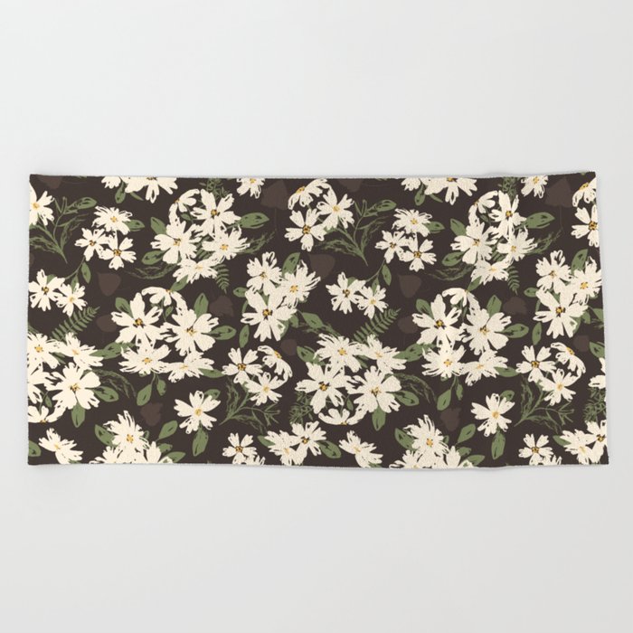Cream and yellow flowers over brown background Beach Towel