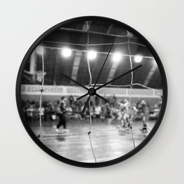 Black and White Photo of a handball game from behind the net Wall Clock
