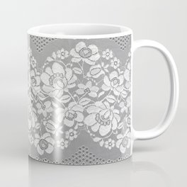 White color straight strip of lace fabric on gray background. Elastic silk nylon braid border. Coffee Mug