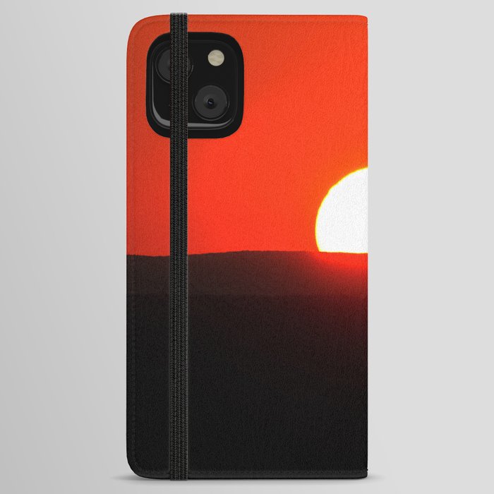 Sun setting over the horizon iPhone Wallet Case