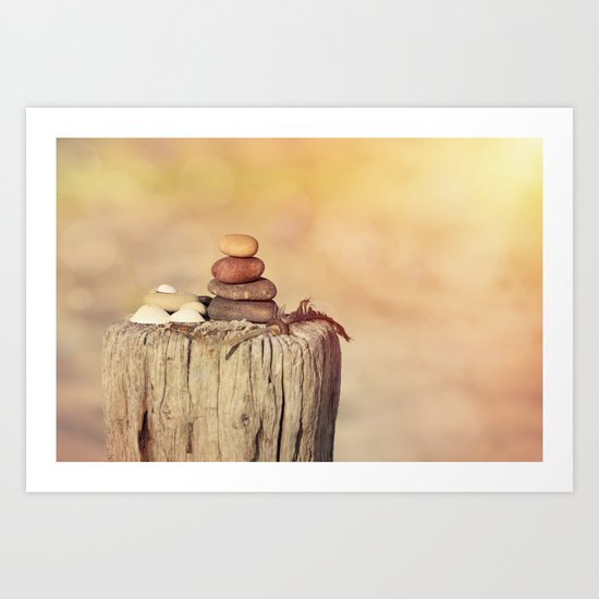 Balanced stone cairn in sunset light Art Print