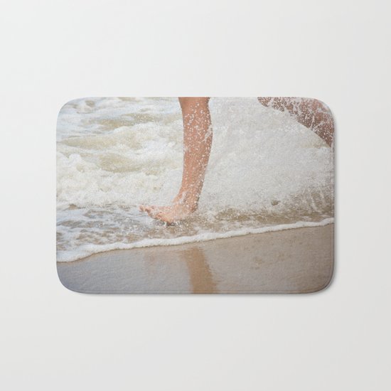 Running on the beach Bath Mat