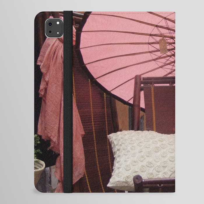 China Photography - Wooden Chair Under A Pink Umbrella In The Street iPad Folio Case