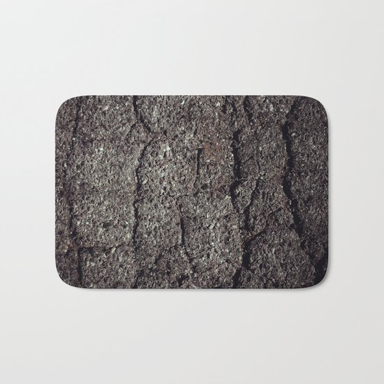 Cracked asphalt road Bath Mat