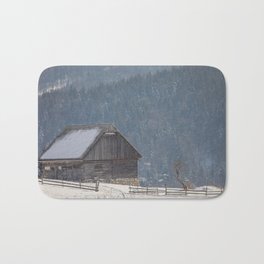 Winter landscape with an old house in a village Bath Mat