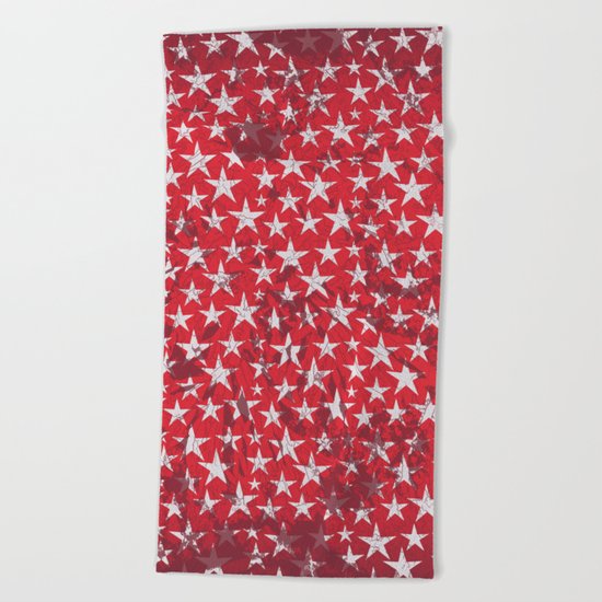 White stars on red grunge textured background Beach Towel