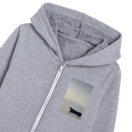 boat in middle of sea with mountains behind it in egypt  Kids Zip Hoodie