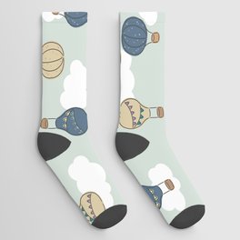 Hand drawn hot air balloons, transportation for adventure seekers on mint green Socks