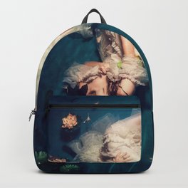 Dreamland and flowers in lily pond; female in white gown floating magical realism fantasy female portrait color photograph / photography Backpack