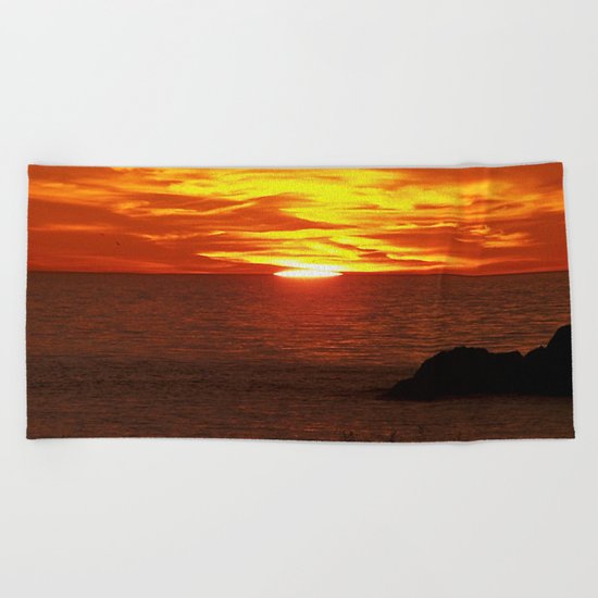 Flaming Skies Across the Sea Beach Towel