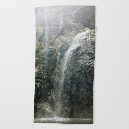 "Sunrays through the waterfall" Beach Towel