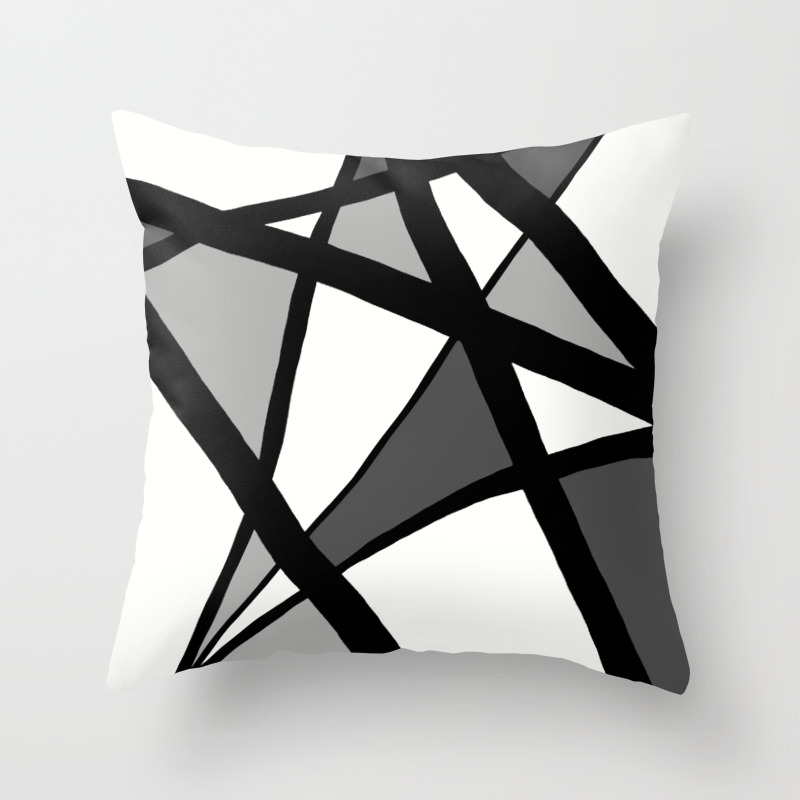 dark grey and white throw pillows