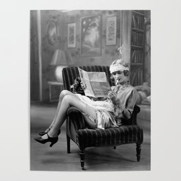 The funny papers; roaring twenties flapper in garter belt and stockings reading newspaper and smoking cigarette portrait black and white vintage photograph - photography - photographs Poster