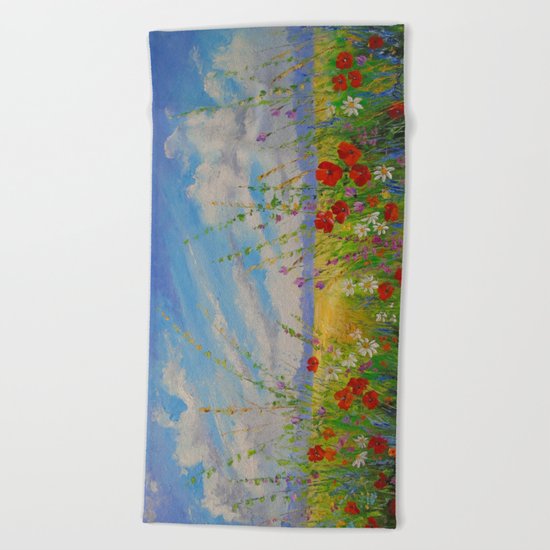 Flowers in a field Beach Towel