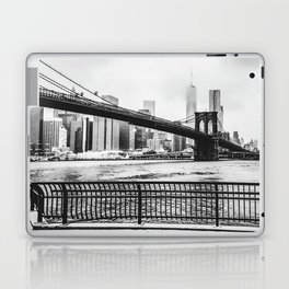 Brooklyn Bridge and Manhattan skyline during winter snowstorm in New York City black and white Laptop Skin