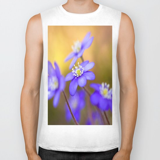 Spring Wildflowers, Beautiful Hepatica in the forest on a sunny and colorful background Biker Tank