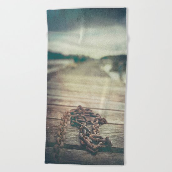 The chained boy Beach Towel