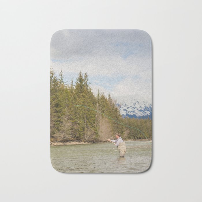 A fly fisherman casting on the Kalum River in the Skeena Region of British Columbia, Canada Bath Mat