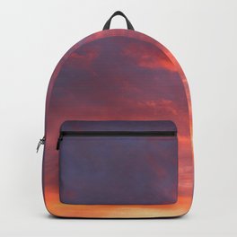 Twilight sky in glowing clouds Backpack