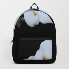 Three Calla Lilies Isolated On A Black Background Backpack