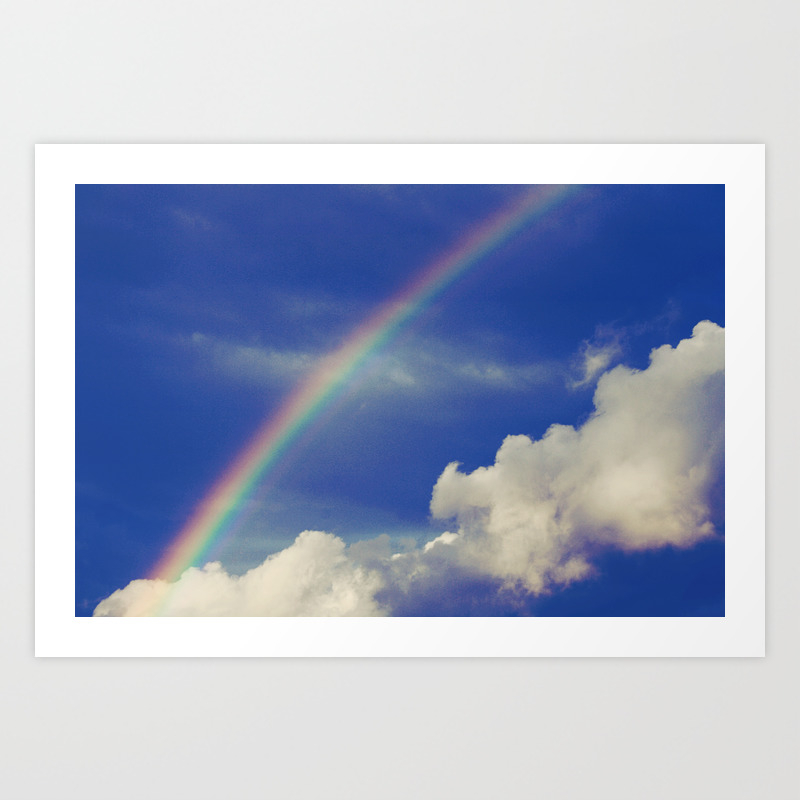 Rainbow Over Fluffy White Clouds In The Blue Sky Art Print By