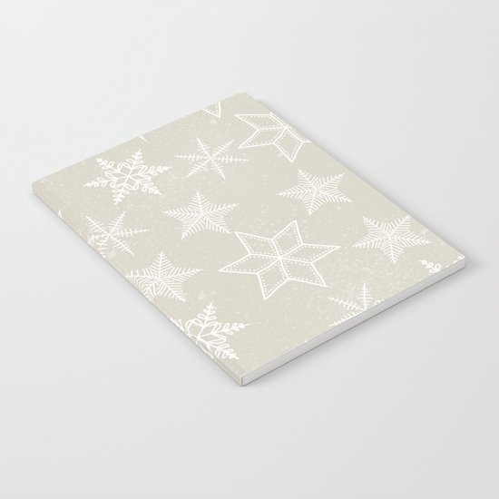 Snowflakes on beige background Notebook