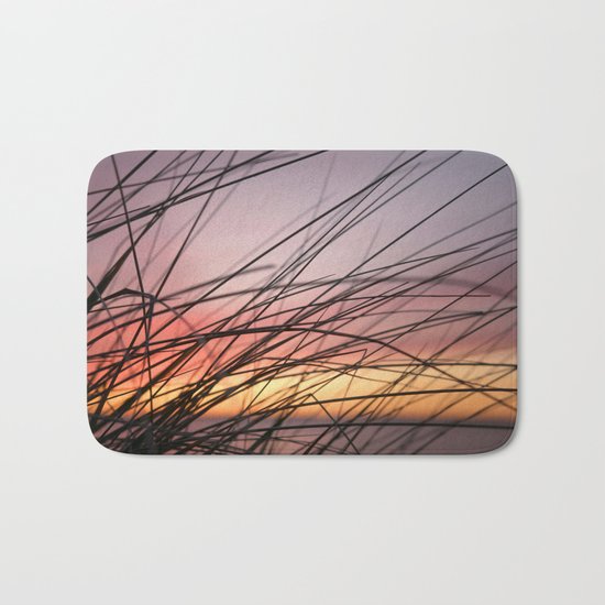 Grasses in the rainbow light of sunset Bath Mat