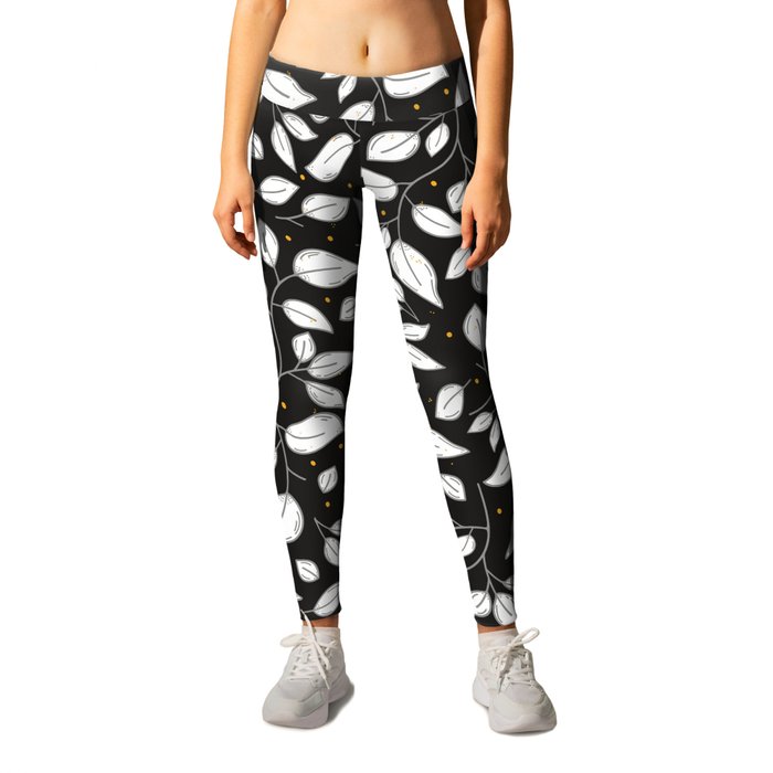Moody black and white leaves pattern with yellow dots Leggings