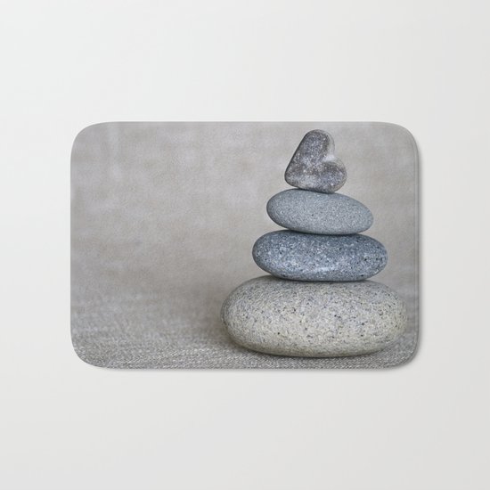 Balanced pebble stack with heart on top Bath Mat