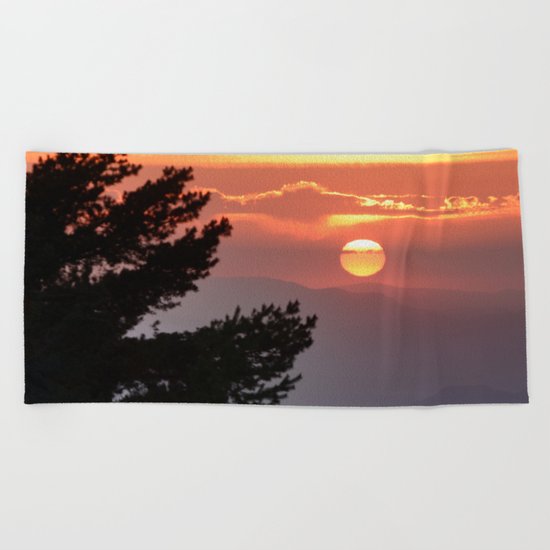 "Sun through the clouds and trees" Sunset at the mountains Beach Towel