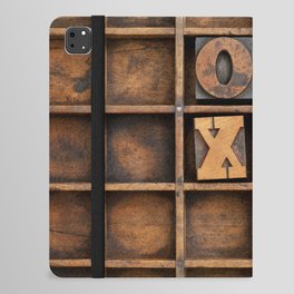 tic-tac-toe or noughts and crosses game - vintage letterpress ing block X and O in wooden grunge typesetter box with dividers iPad Folio Case
