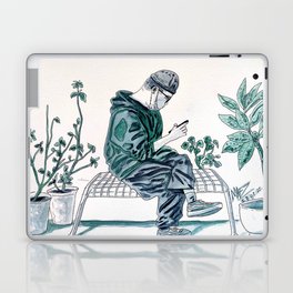 Texting on a bench among plants Laptop Skin