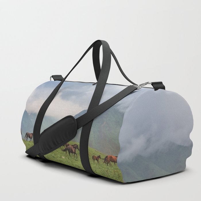 Running horses in the mountains Duffle Bag