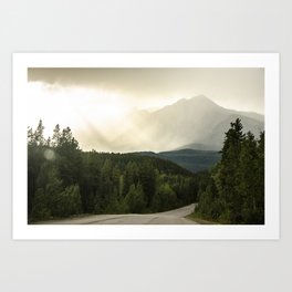 Sun shining through clouds in the Rocky Mountains Art Print