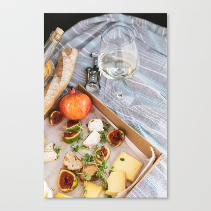 Different delicious food and glass of wine on picnic Canvas Print