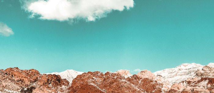 Vintage Red Rocks Snow In The Mojave Desert Clouds Teal Sky Mountain Range Landscape Coffee Mug