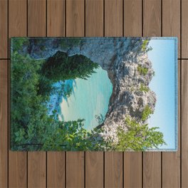 Looking at Lake Michigan through Arch Rock on Mackinac Island in Michigan Outdoor Rug