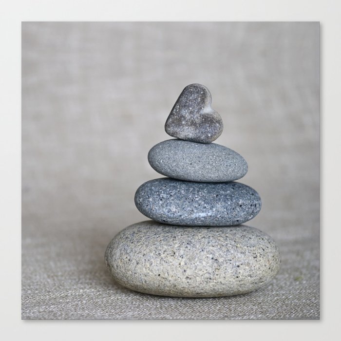 Balanced pebble stack with heart on top Canvas Print