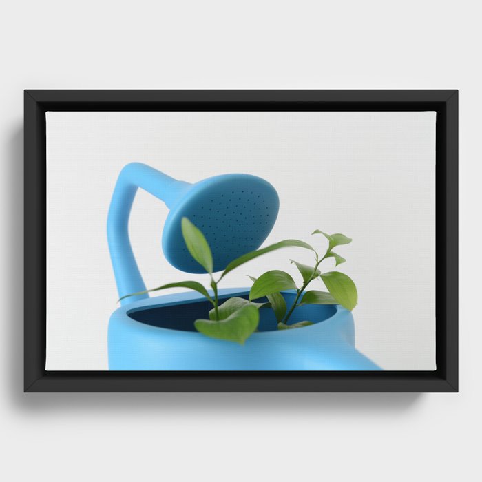 The Uncomfortable watering can and leaves Framed Canvas