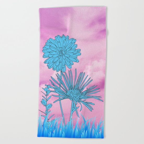 Flowers in grass Beach Towel