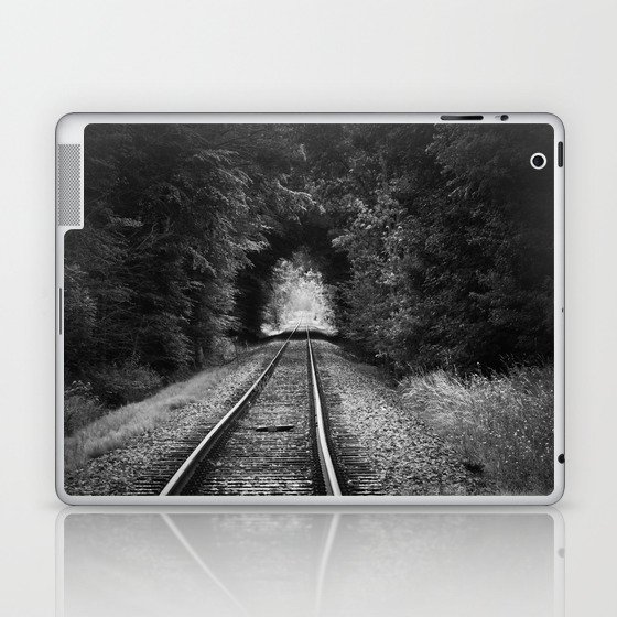 Don't go riding on the long black train; lonely railroad tracks through natural tunnel of leafy trees black and white photograph - photography - photographs Laptop & iPad Skin